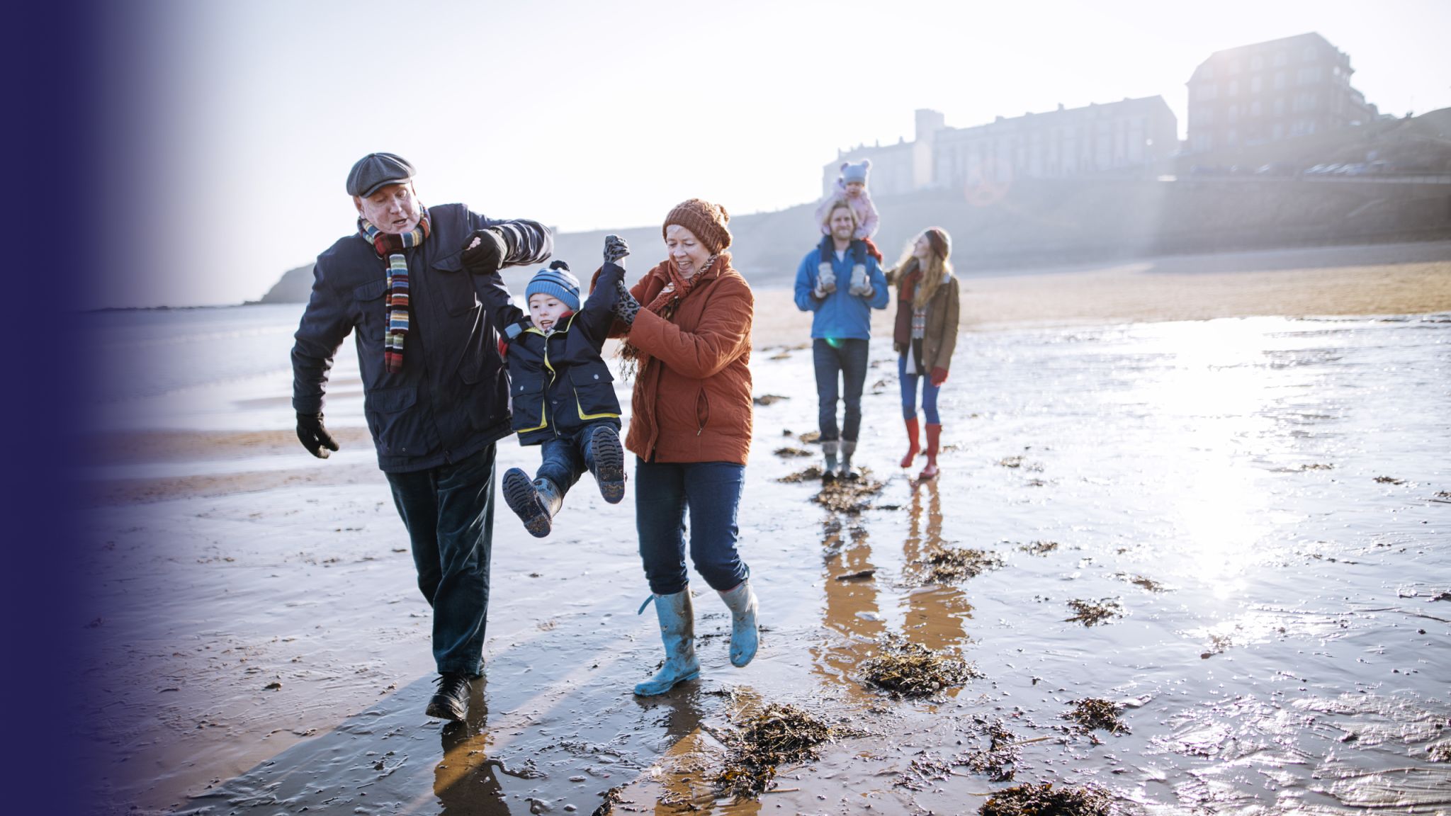 Multi-Generation Family Walking Along the Beach